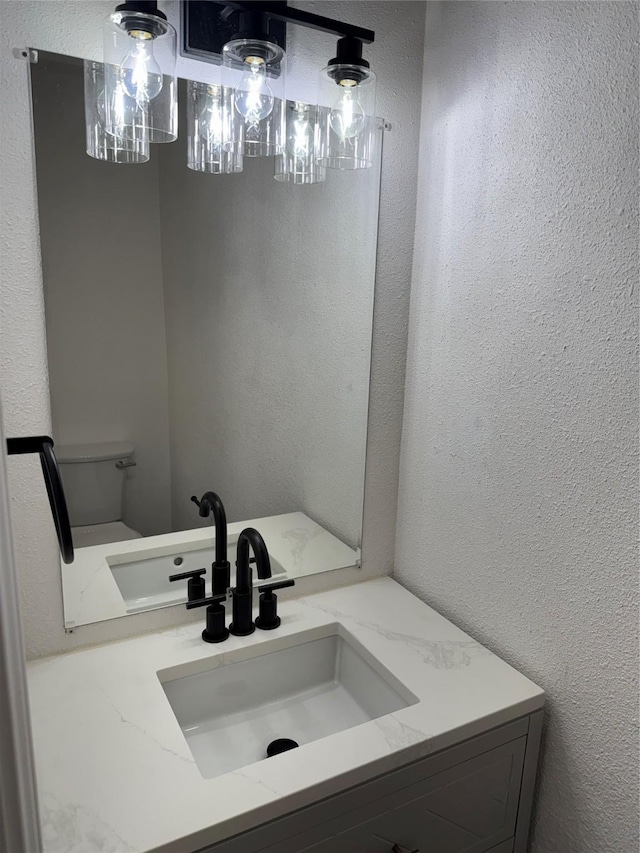14800 Enterprise Dr Unit 17B, Farmers Branch, TX 75234 - bathroom with a textured wall and vanity