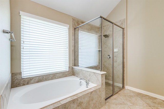 9728 Bitterroot Dr, Little Elm, TX 75068 - full bathroom featuring a bath, a stall shower, and tile patterned floors