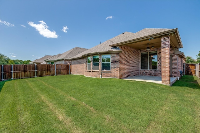 9728 Bitterroot Dr, Little Elm, TX 75068 - back of property featuring brick siding, ceiling fan, a fenced backyard, a patio, and roof with shingles