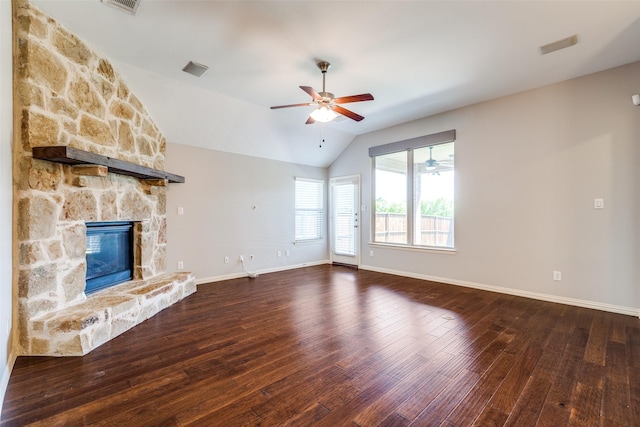 9728 Bitterroot Dr, Little Elm, TX 75068 - unfurnished living room featuring ceiling fan, hardwood / wood-style flooring, vaulted ceiling, and a stone fireplace