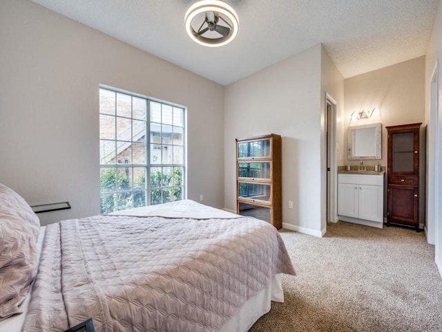 1603 Marsh Ln Unit 308, Carrollton, TX 75006 - carpeted bedroom featuring ensuite bath and baseboards
