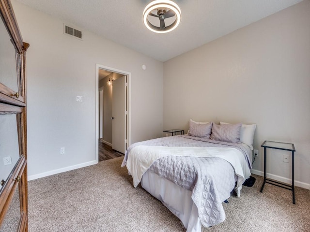 1603 Marsh Ln Unit 308, Carrollton, TX 75006 - bedroom with light colored carpet and baseboards