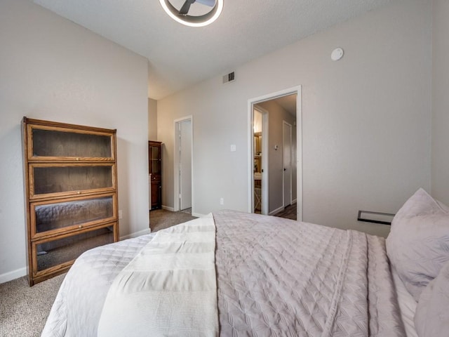 1603 Marsh Ln Unit 308, Carrollton, TX 75006 - bedroom featuring carpet flooring and baseboards