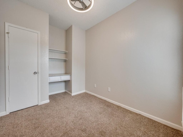 1603 Marsh Ln Unit 308, Carrollton, TX 75006 - unfurnished bedroom with light carpet, baseboards, and vaulted ceiling