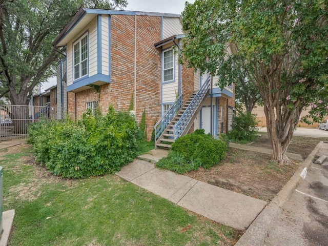 1603 Marsh Ln Unit 308, Carrollton, TX 75006 - view of front of house with stairs and brick siding