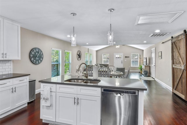 1105 Florence St, Mckinney, TX 75069 - kitchen featuring dishwasher, a sink, a barn door, open floor plan, and dark wood-style flooring