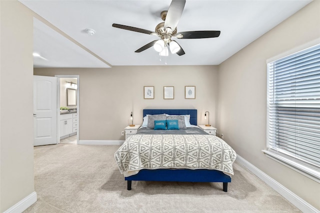 1105 Florence St, Mckinney, TX 75069 - bedroom featuring light carpet, baseboards, ensuite bathroom, and a ceiling fan