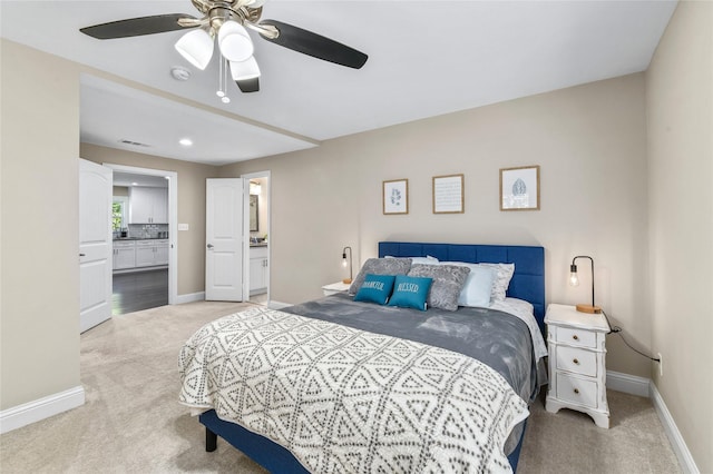 1105 Florence St, Mckinney, TX 75069 - bedroom with light carpet, baseboards, connected bathroom, and ceiling fan