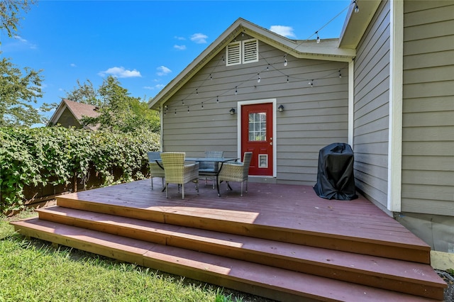 1105 Florence St, Mckinney, TX 75069 - wooden terrace with a grill and outdoor dining area