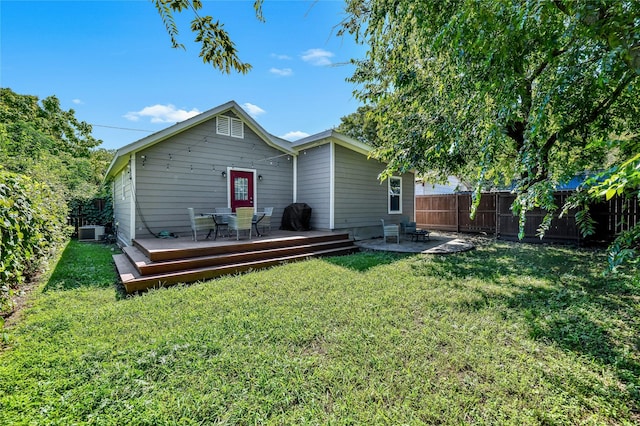 1105 Florence St, Mckinney, TX 75069 - back of house featuring central air condition unit, a wooden deck, and a patio