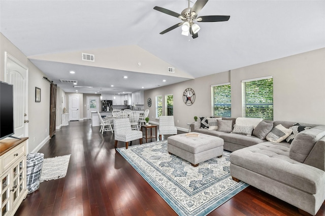 1105 Florence St, Mckinney, TX 75069 - living room featuring lofted ceiling, dark wood-style flooring, a ceiling fan, a barn door, and recessed lighting