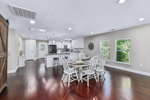 1105 Florence St, Mckinney, TX 75069 - dining area featuring baseboards, dark wood-style flooring, recessed lighting, and a barn door