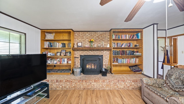 1133 Vz County Road 2205, Canton, TX 75103 - living room featuring wood finished floors, ceiling fan, crown molding, and a wood stove