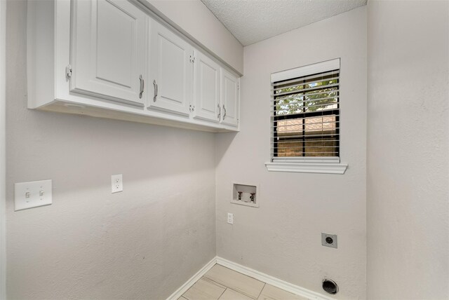 5008 Hatherly Dr, Plano, TX 75023 - washroom with cabinet space, electric dryer hookup, baseboards, hookup for a washing machine, and a textured ceiling