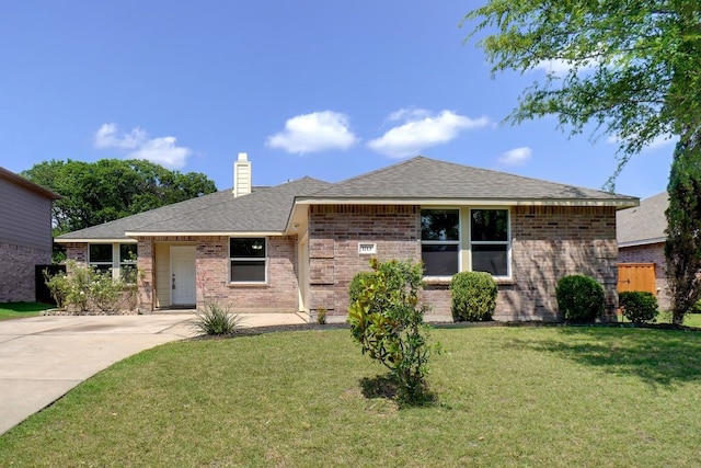 1713 Harvest Crossing Dr, Wylie, TX 75098 - ranch-style house with brick siding, a front yard, a chimney, concrete driveway, and a shingled roof