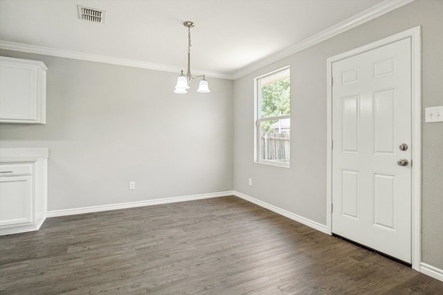 1713 Harvest Crossing Dr, Wylie, TX 75098 - unfurnished dining area with dark wood-style floors, crown molding, baseboards, and a chandelier