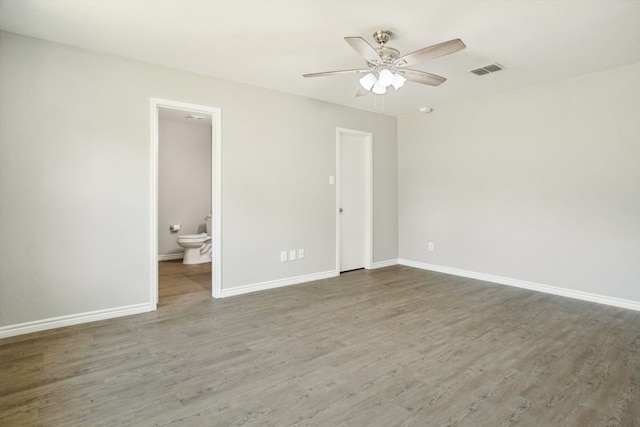 1713 Harvest Crossing Dr, Wylie, TX 75098 - unfurnished bedroom featuring wood finished floors, baseboards, ensuite bath, and a ceiling fan