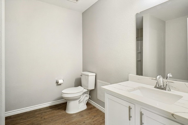1713 Harvest Crossing Dr, Wylie, TX 75098 - bathroom with vanity, wood finished floors, toilet, and baseboards
