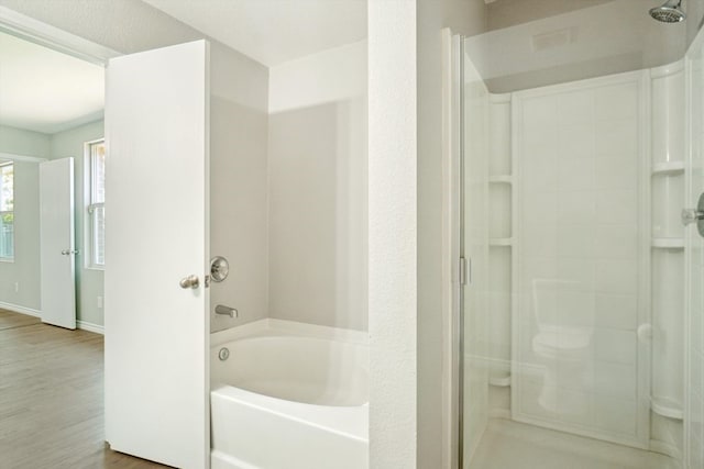 1713 Harvest Crossing Dr, Wylie, TX 75098 - bathroom with a stall shower, a bath, wood finished floors, and baseboards