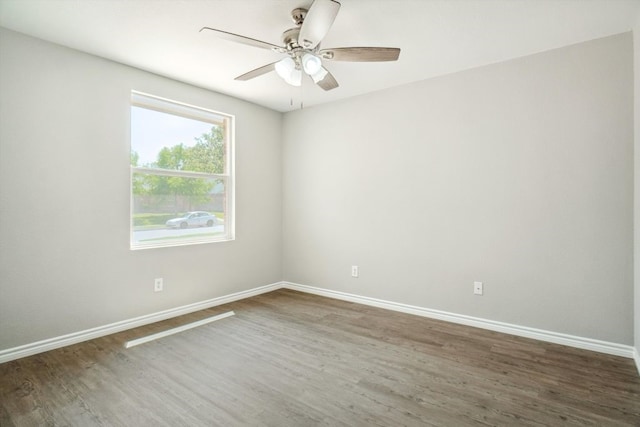 1713 Harvest Crossing Dr, Wylie, TX 75098 - spare room with wood finished floors, baseboards, and a ceiling fan