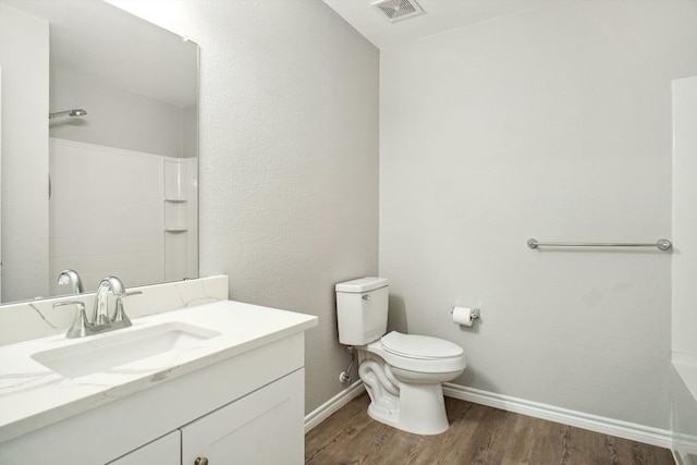 1713 Harvest Crossing Dr, Wylie, TX 75098 - full bathroom with wood finished floors, toilet, vanity, and baseboards