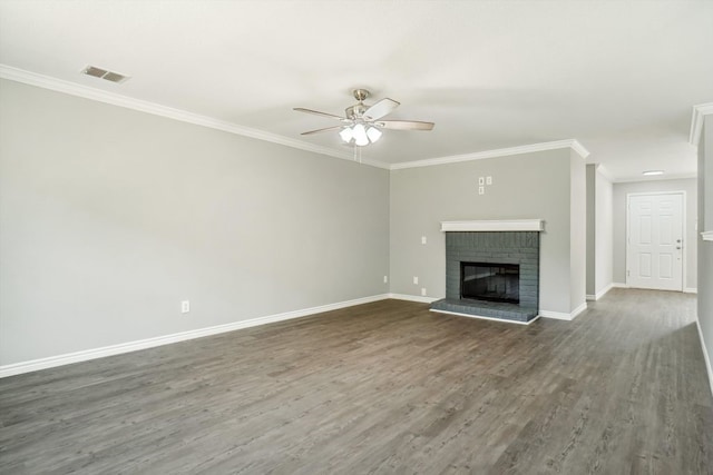 1713 Harvest Crossing Dr, Wylie, TX 75098 - unfurnished living room with a ceiling fan, baseboards, crown molding, dark wood finished floors, and a brick fireplace