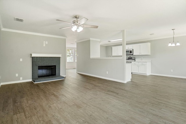 1713 Harvest Crossing Dr, Wylie, TX 75098 - unfurnished living room featuring a ceiling fan, wood finished floors, baseboards, ornamental molding, and a brick fireplace