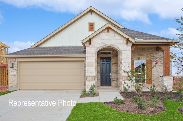 2401 Ridgecrest Ln, Sherman, TX 75092 - view of front facade featuring board and batten siding, brick siding, driveway, and a garage