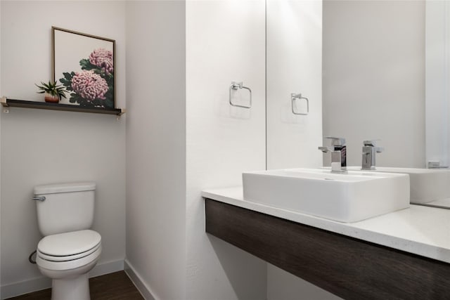 860 Baugh Dr, Allen, TX 75013 - bathroom featuring toilet, vanity, baseboards, and wood finished floors