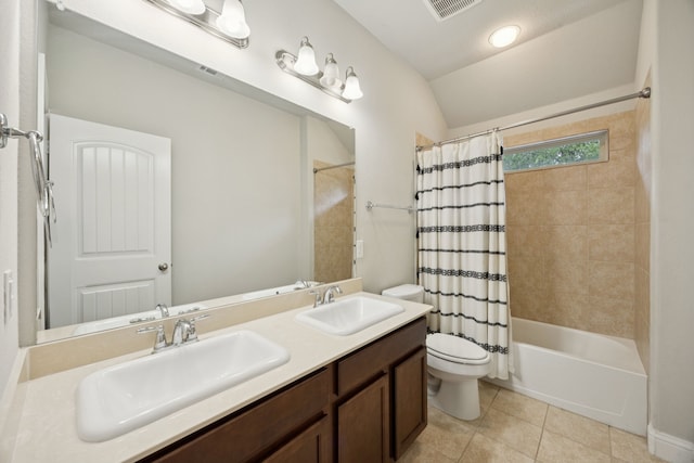 7717 Lake Worth Cv, Mckinney, TX 75071 - full bathroom featuring toilet, tile patterned floors, vaulted ceiling, double vanity, and shower / tub combo with curtain