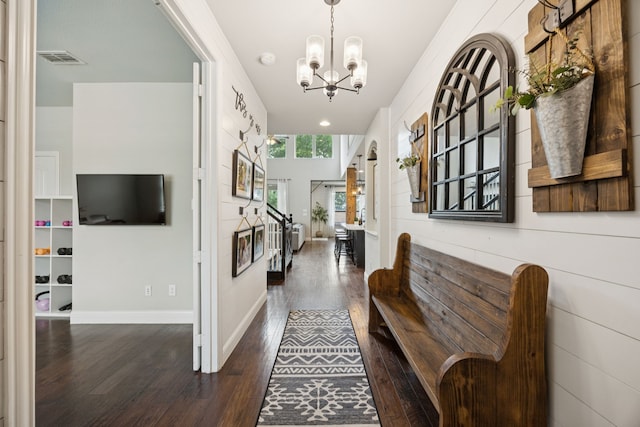 7717 Lake Worth Cv, Mckinney, TX 75071 - foyer featuring dark wood-type flooring, a chandelier, and baseboards