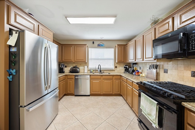 1230 Donegal Ln, Garland, TX 75044 - kitchen featuring black appliances, a sink, decorative backsplash, light tile patterned flooring, and light stone counters