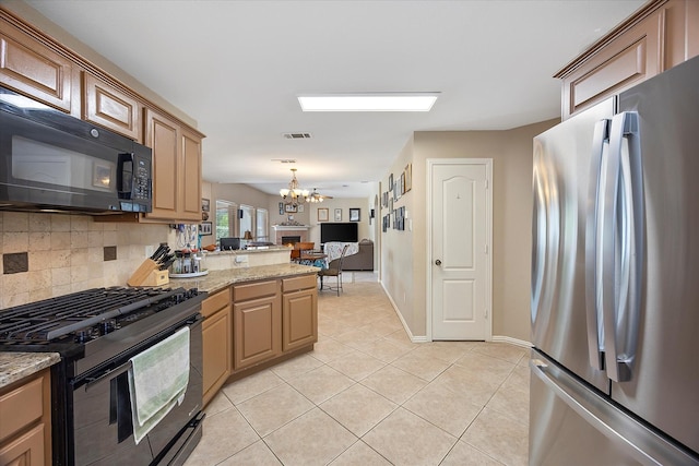 1230 Donegal Ln, Garland, TX 75044 - kitchen with black appliances, a chandelier, light tile patterned floors, tasteful backsplash, and a peninsula