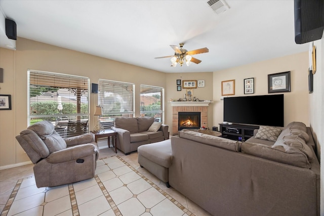 1230 Donegal Ln, Garland, TX 75044 - living room featuring a ceiling fan, a brick fireplace, and light tile patterned floors