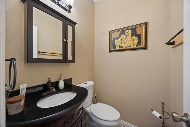 1230 Donegal Ln, Garland, TX 75044 - half bathroom with toilet and vanity