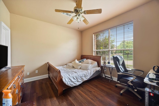 1230 Donegal Ln, Garland, TX 75044 - bedroom with dark wood-style flooring, baseboards, an office area, and ceiling fan