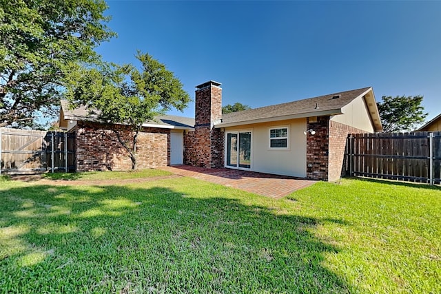 4804 Jennings Cir, The Colony, TX 75056 - rear view of property featuring a chimney, brick siding, and stucco siding