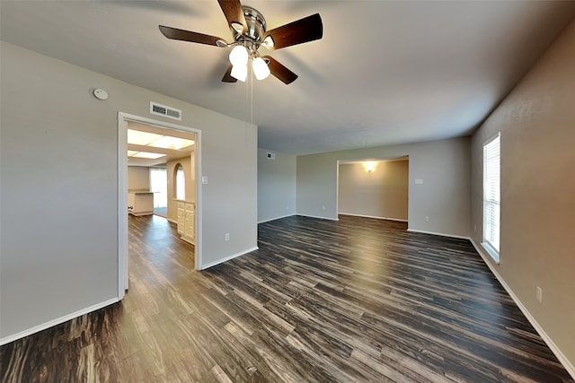 4804 Jennings Cir, The Colony, TX 75056 - spare room with dark wood finished floors, a ceiling fan, a smoke detector, and baseboards