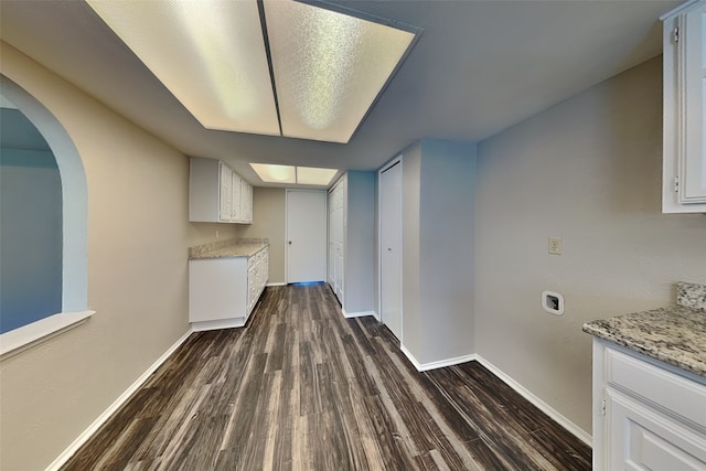 4804 Jennings Cir, The Colony, TX 75056 - unfurnished dining area featuring dark wood finished floors, baseboards, and arched walkways
