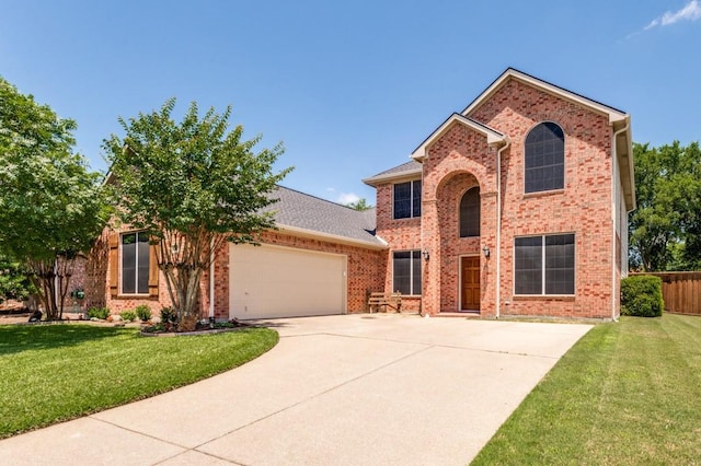 1715 Grand Canyon Way, Allen, TX 75002 - view of front of home featuring brick siding, an attached garage, and driveway