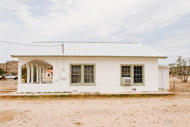 121 E E Ave B, Sanderson, TX 79848 - view of home's exterior featuring metal roof and cooling unit