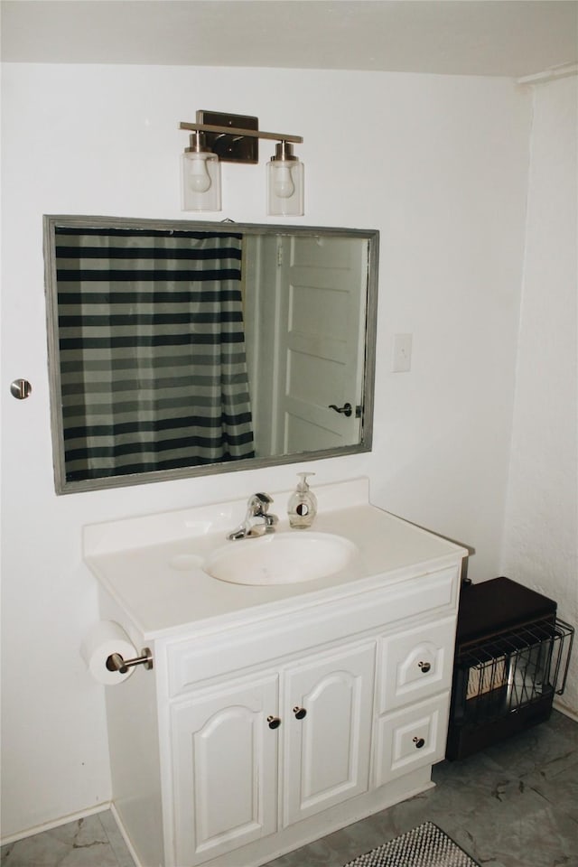 121 E E Ave B, Sanderson, TX 79848 - bathroom featuring vanity and baseboards