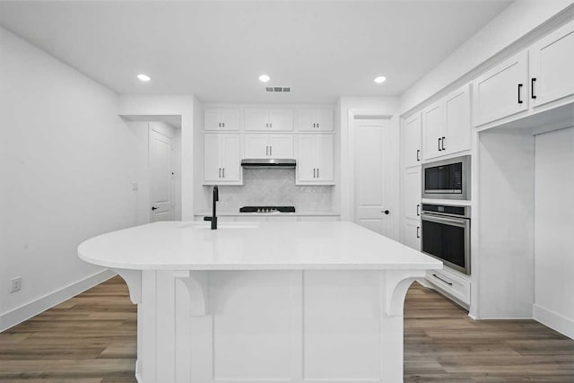 1624 Palo Duro Way, Celina, TX 75009 - kitchen with stainless steel oven, built in microwave, a sink, baseboards, and under cabinet range hood