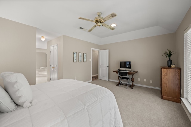 7213 Maranatha Ct, Colleyville, TX 76034 - bedroom with light carpet, baseboards, ensuite bathroom, a ceiling fan, and a raised ceiling