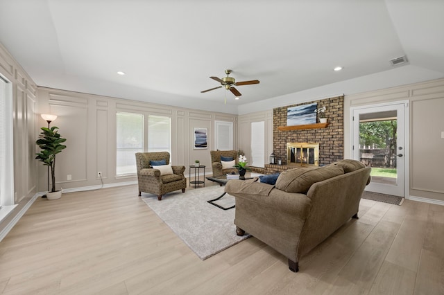 7213 Maranatha Ct, Colleyville, TX 76034 - living area featuring a decorative wall, ceiling fan, light wood-style floors, a brick fireplace, and recessed lighting