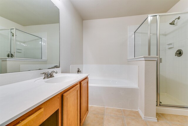 4008 Kyndra Cir, Richardson, TX 75082 - bathroom featuring a bath, a stall shower, vanity, and tile patterned floors