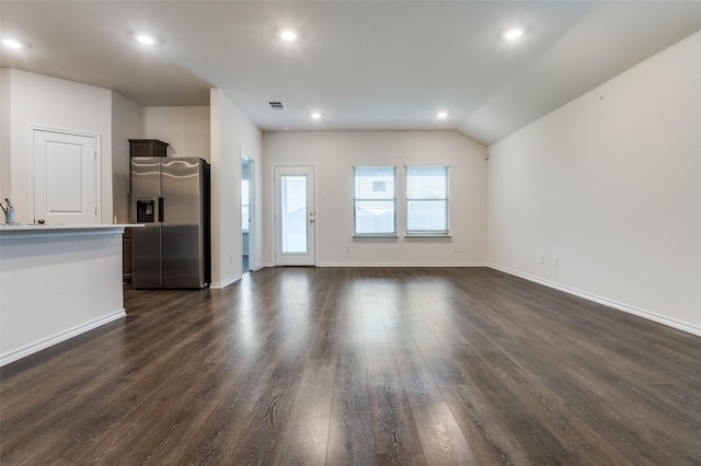 1937 Duskwood Dr, Lancaster, TX 75146 - unfurnished living room featuring dark wood-style floors, recessed lighting, and lofted ceiling