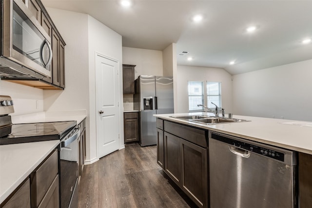 1937 Duskwood Dr, Lancaster, TX 75146 - kitchen featuring appliances with stainless steel finishes, dark wood finished floors, dark brown cabinetry, light countertops, and recessed lighting