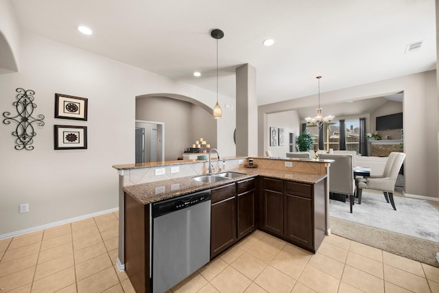 334 Hawthorn Dr, Fate, TX 75087 - kitchen with stainless steel dishwasher, a sink, arched walkways, dark brown cabinetry, and a chandelier