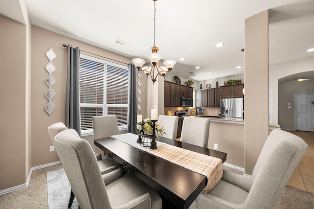 334 Hawthorn Dr, Fate, TX 75087 - dining area featuring arched walkways, a chandelier, baseboards, and recessed lighting